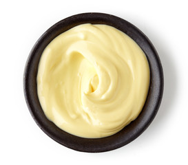 Mayonnaise in round dish on white background