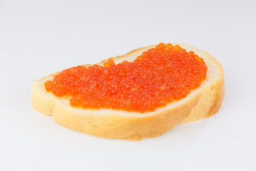 Naklejka na ściany i meble delicious appetizing sandwich with red caviar on white