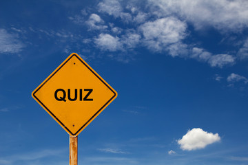 yellow sign with text QUIZ