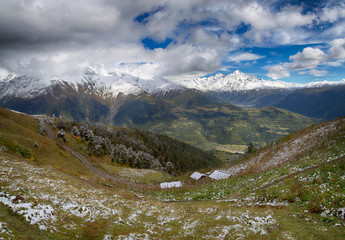 Fototapeta na wymiar Mountains in low stormy clouds before the rain. Caucasus Mountains. Georgia, region Svanetia.