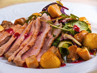 Roasted pork on white plate