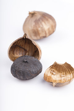 Black garlic isolated on the white background