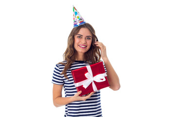 Woman in celebration cap holding a present 