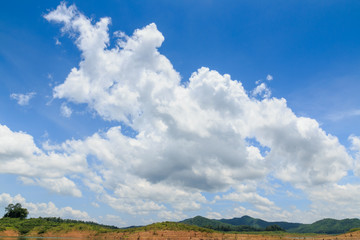 Blue sky with white clouds  and hill