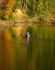 Fototapeta na wymiar Canoe paddling in fall in Ontario