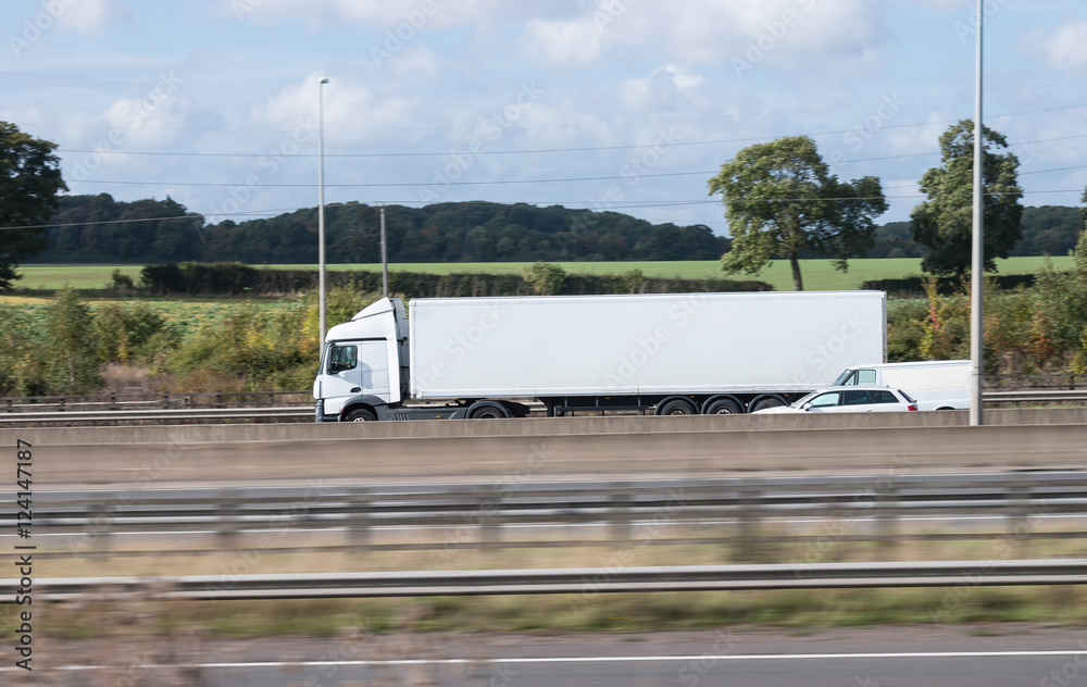 Wall mural white lorry in motion on the motorway