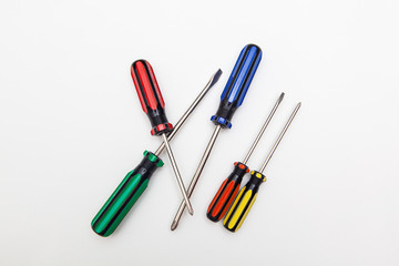 colorful screwdrivers on white backgrounds