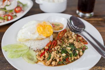 Close up Rice topped with stir fried minced pork and basil.