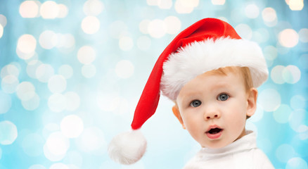beautiful little baby boy in christmas santa hat