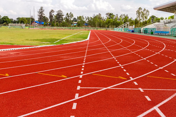 white dash line on red running track