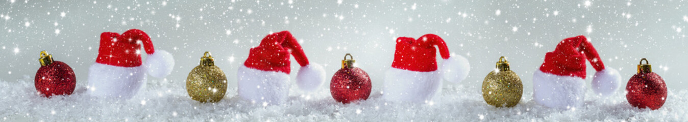 Fototapeta na wymiar Christmas background with Christmas balls and cap of Santa Claus