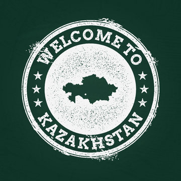 White chalk texture retro stamp with Republic of Kazakhstan map on a green blackboard. Grunge rubber seal with country outlines, vector illustration.