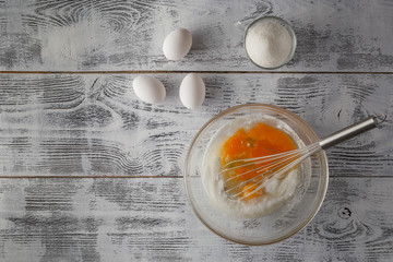 making vanilla sauce in a glass bowl with whipper