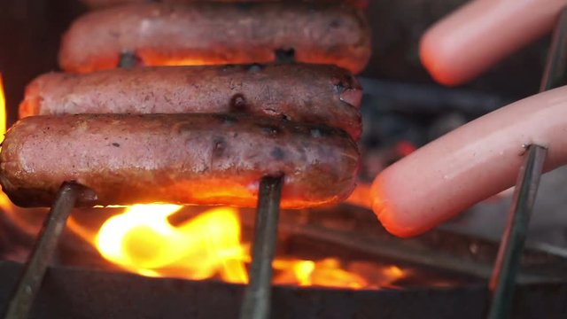 Sausages are fried on fire
