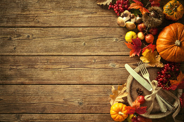 Autumn background from fallen leaves and fruits with vintage pla - obrazy, fototapety, plakaty