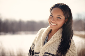 Beautiful young woman in the snow in winter - obrazy, fototapety, plakaty