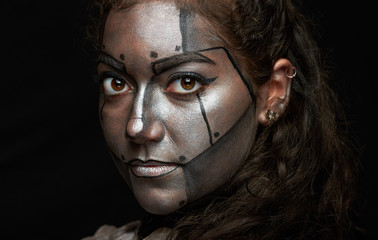 macro of woman  face with metal mask
