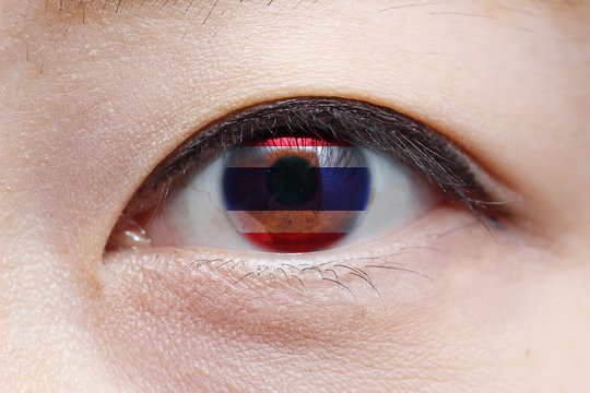 woman eye with thailand national flag inside