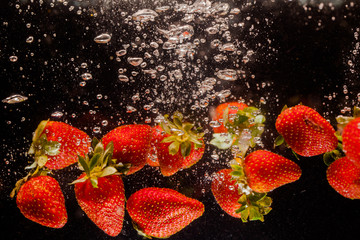 splash strawberry on water