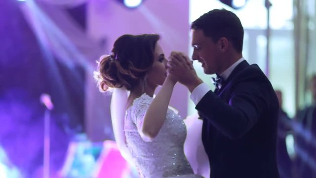 Just married couple is dancing at wedding party