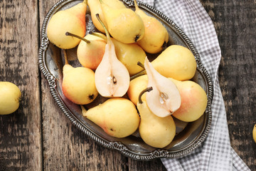 ripe pears on vitage wooden table