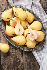 ripe pears on vitage wooden table