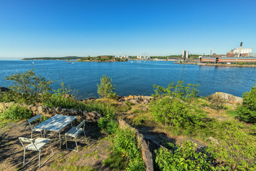 Fototapeta premium Coastal rest place with city bay view