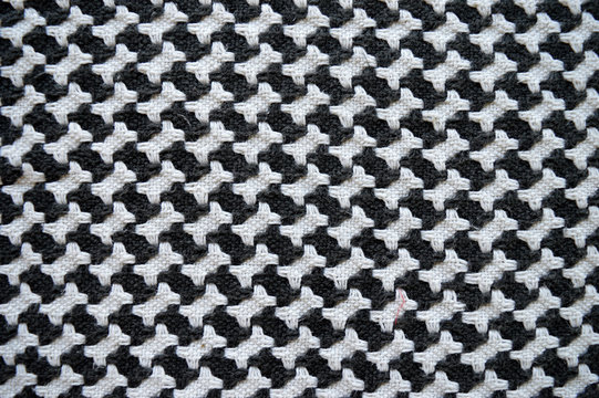 Bones / houndstooth knitted carpet background