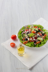 fresh Greek salad on a light background