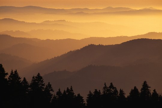 Hazy ridges of Trinity Alps at sunset, California, USA