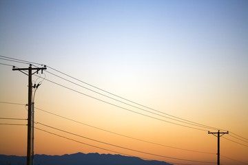 Silhouette Of Power Lines At Sunset