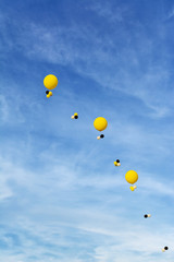 Helium balloons in the blue sky