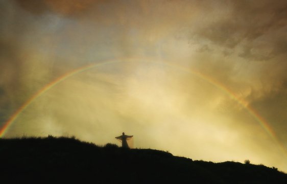 Rainbow Over Angel On Hill