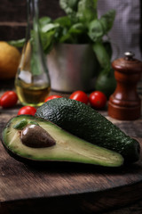 food background with fresh organic avocado on old wooden table, top view, copy space