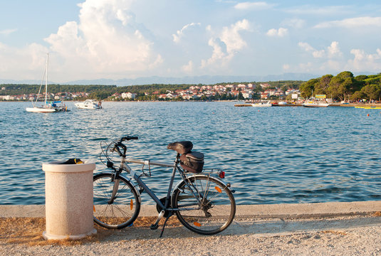 A bicycle standing near the sea