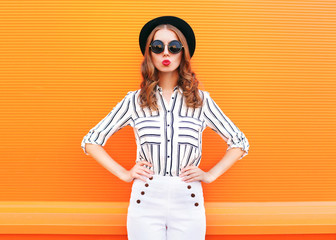 Fashion pretty glamour woman wearing a black hat sunglasses whit