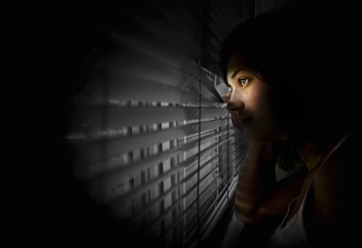 Girl Peeking Out Of Window