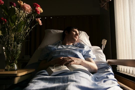 Man In A Hospital Bed