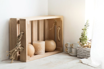 Close up of wooden box decorated with candles