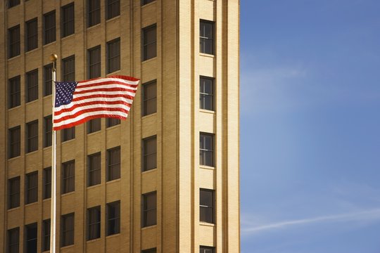 San Antonio, Texas, United States Of America; An American Flag In Front Of A Building