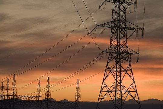 Calgary, Alberta, Canada; Electricity Towers And Wires At Sunset