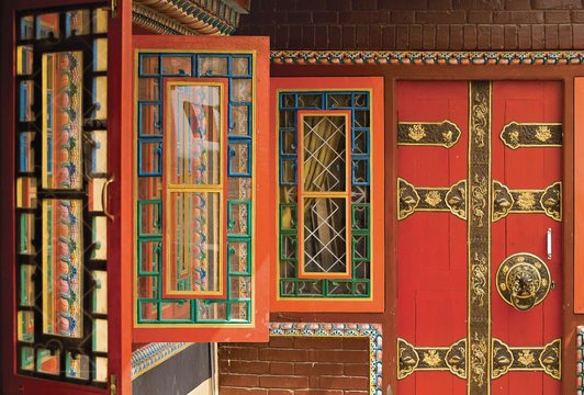 Row of colorful open windows at buddhist monastery, Kathmandu, Nepal