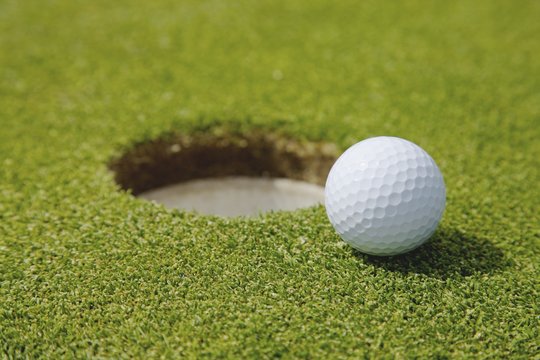 Golf ball near a hole