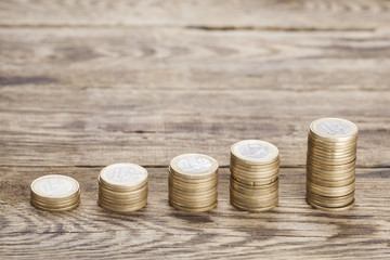 Stacks of coins on wood table