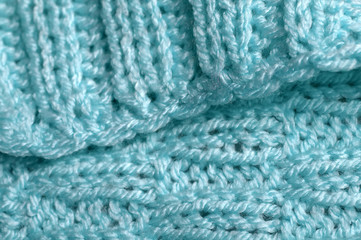 Piece of knitting work - blue yarn stitches - macro