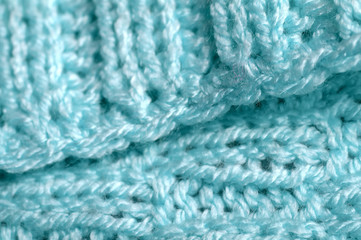 Piece of knitting work - blue yarn stitches - macro