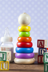 Children's World toy on a wooden background.