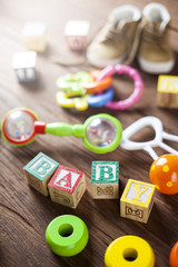 Children's World toy on a wooden background.