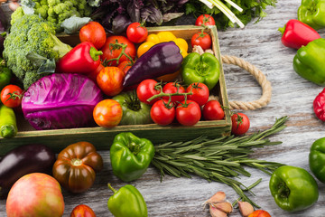 Set of raw vegetables in the wooden tray