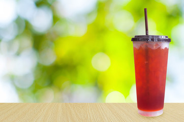 iced tea on green nature background ,Summer drinks with ice